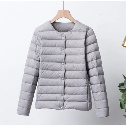 Misha - packable puffer jacket with snap closure