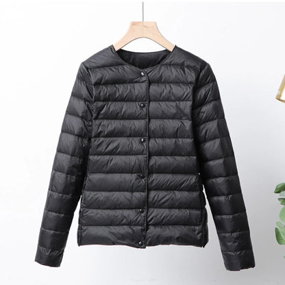 Misha - packable puffer jacket with snap closure