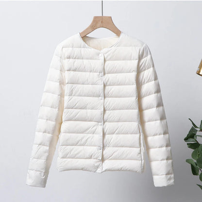 Misha - packable puffer jacket with snap closure