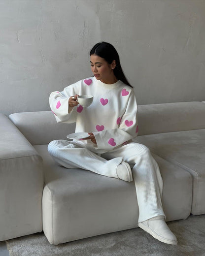 Women's solid color round neck knitted sweater with heart print