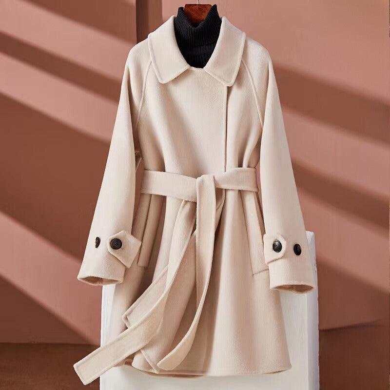 Women's reversible mid-length with belt cinched waist jacket
