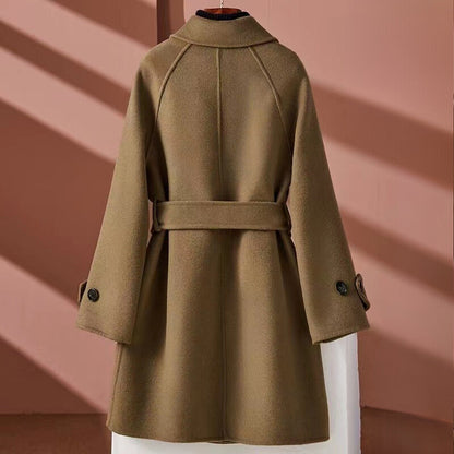Women's reversible mid-length with belt cinched waist jacket