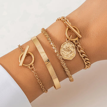 Gold layered bracelet set with coin charm