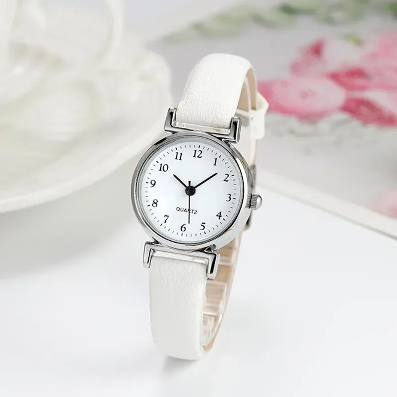 Classic round quartz women's wristwatch with minimalist leather strap