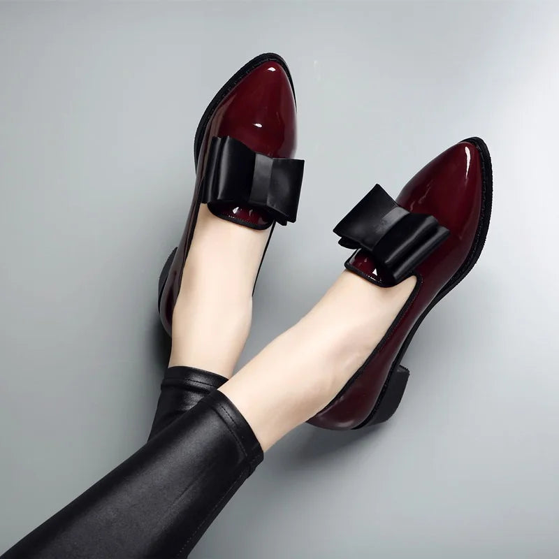 Women's elegant glossy slip-on flats with bow accent