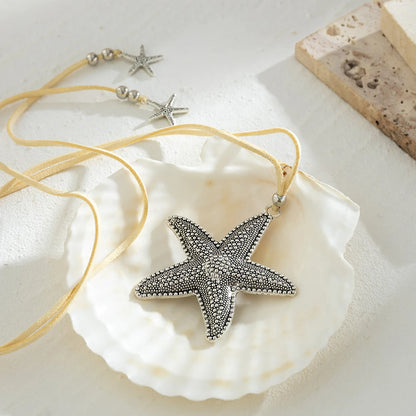 Silver starfish pendant necklace with adjustable cord