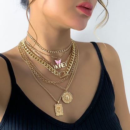 Gold layered chain necklace set with "Honey" pendant