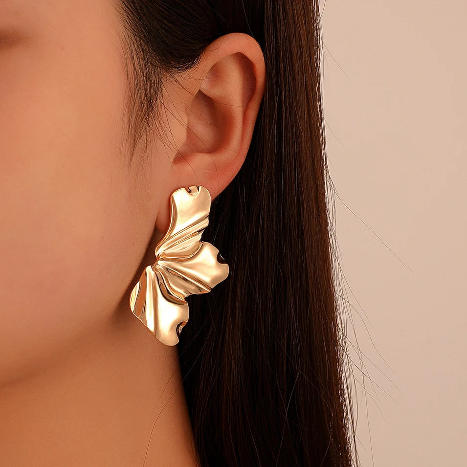 Women's metallic flower-shaped statement earrings