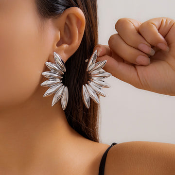 Abstract nature-inspired statement earrings with a flowing design