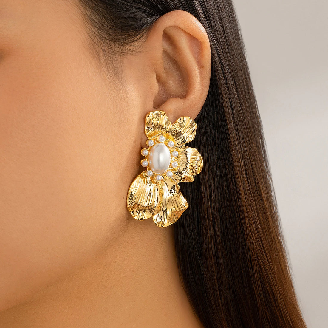 Floral statement earrings with a pearl center