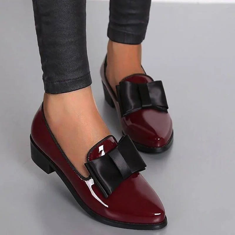 Women's elegant glossy slip-on flats with bow accent