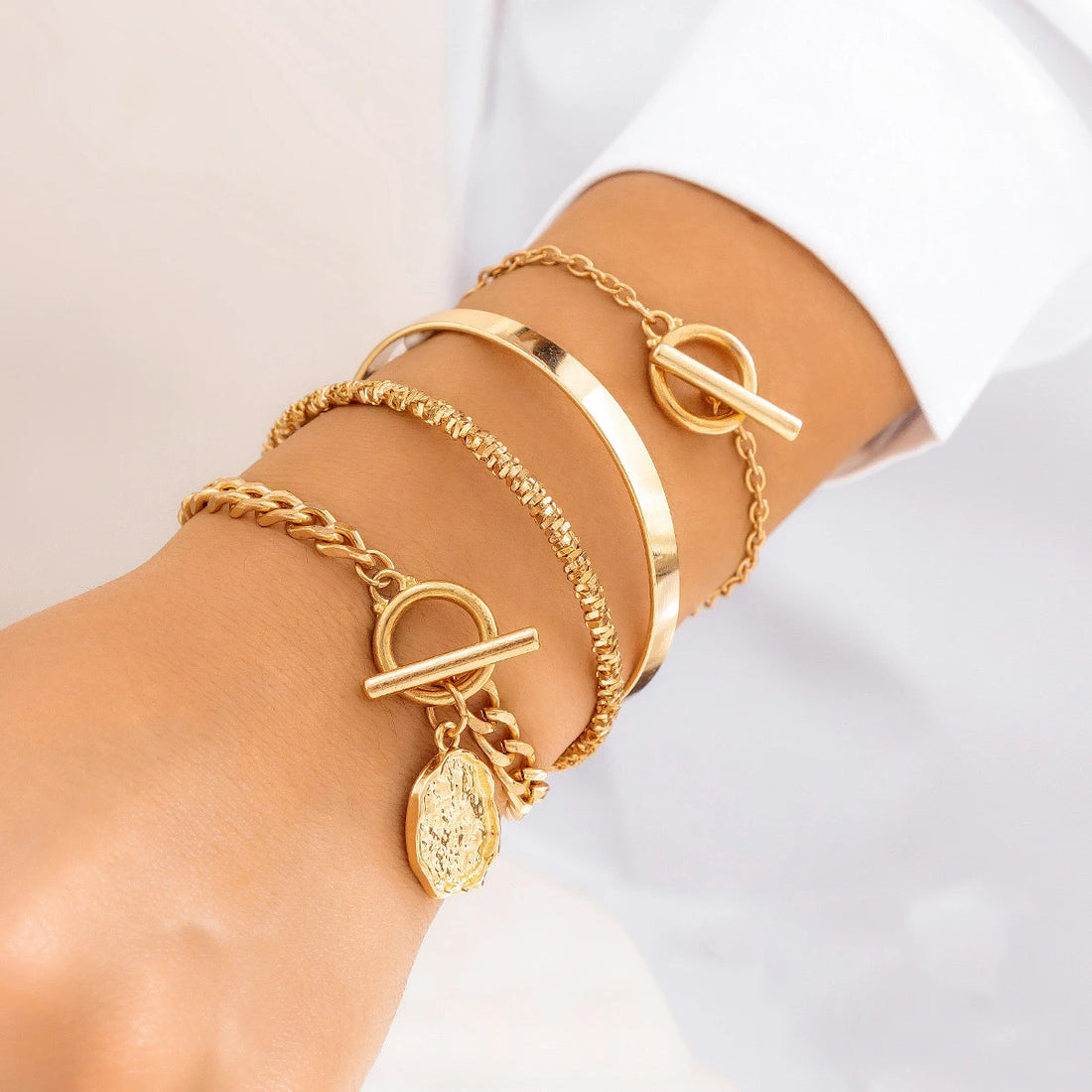 Gold layered bracelet set with coin charm