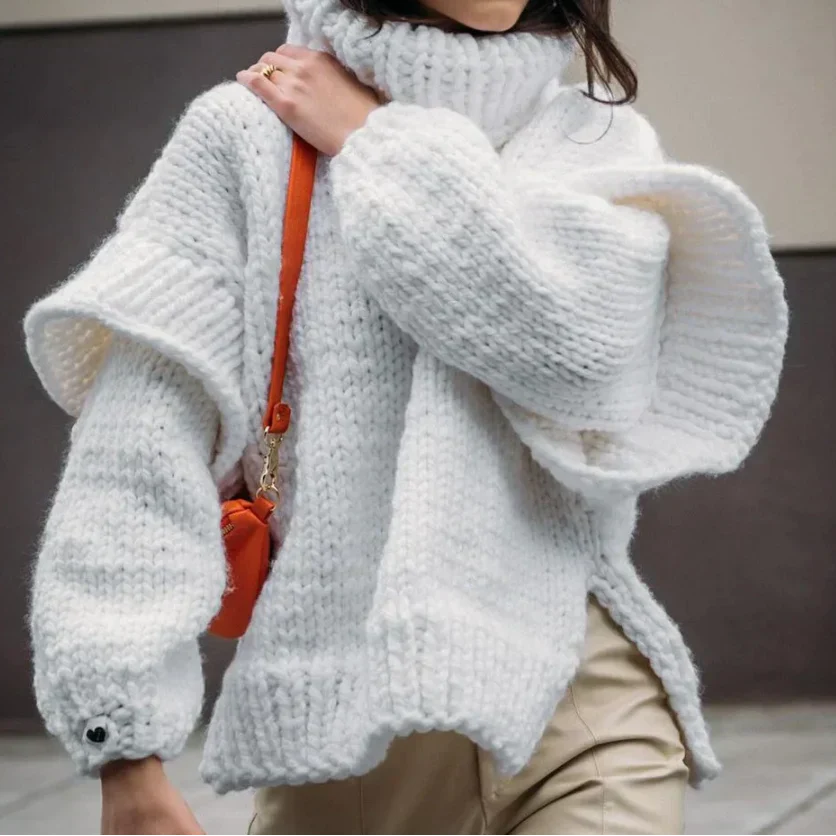Women's chunky knit turtleneck sweater with stylish sleeves