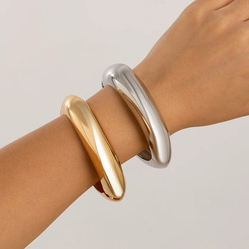 Women's chunky polished metal cuff bracelets