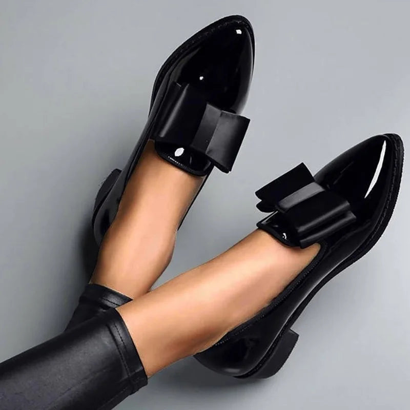 Women's elegant glossy slip-on flats with bow accent