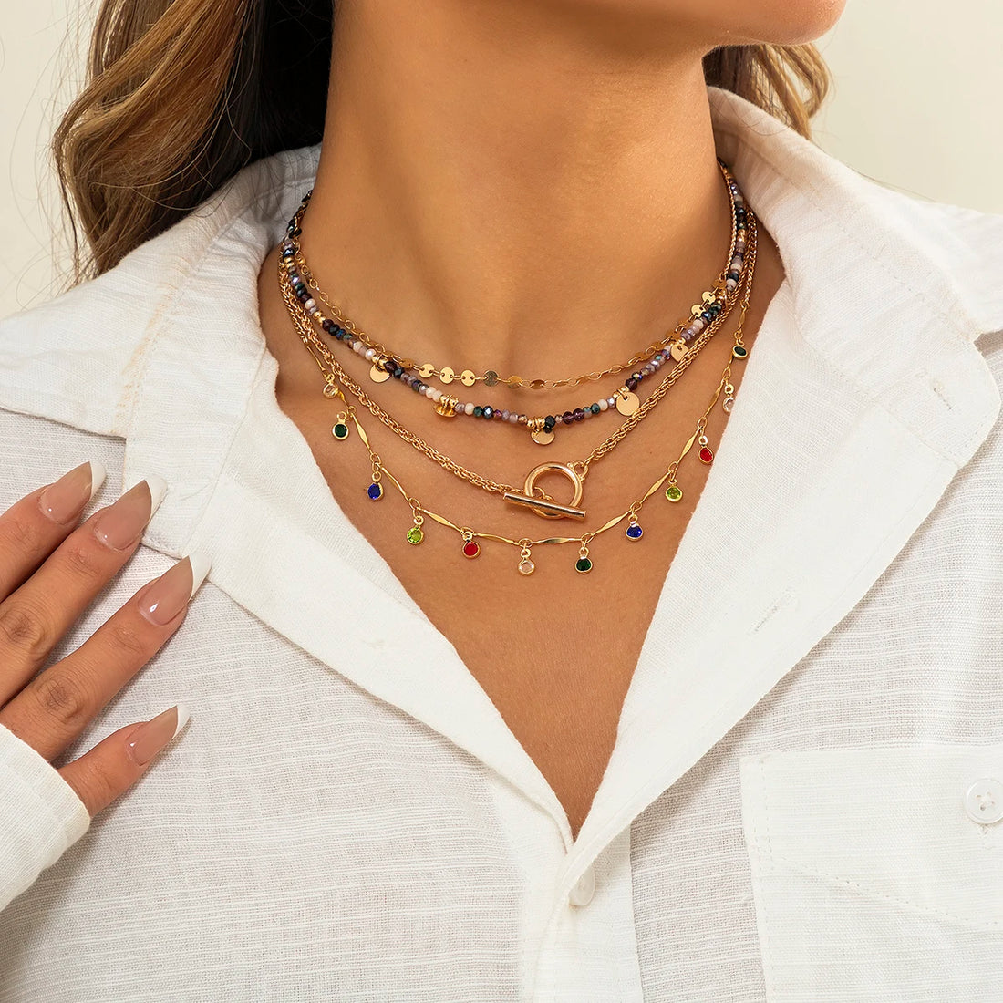 Multi-layered beaded and charm necklace set