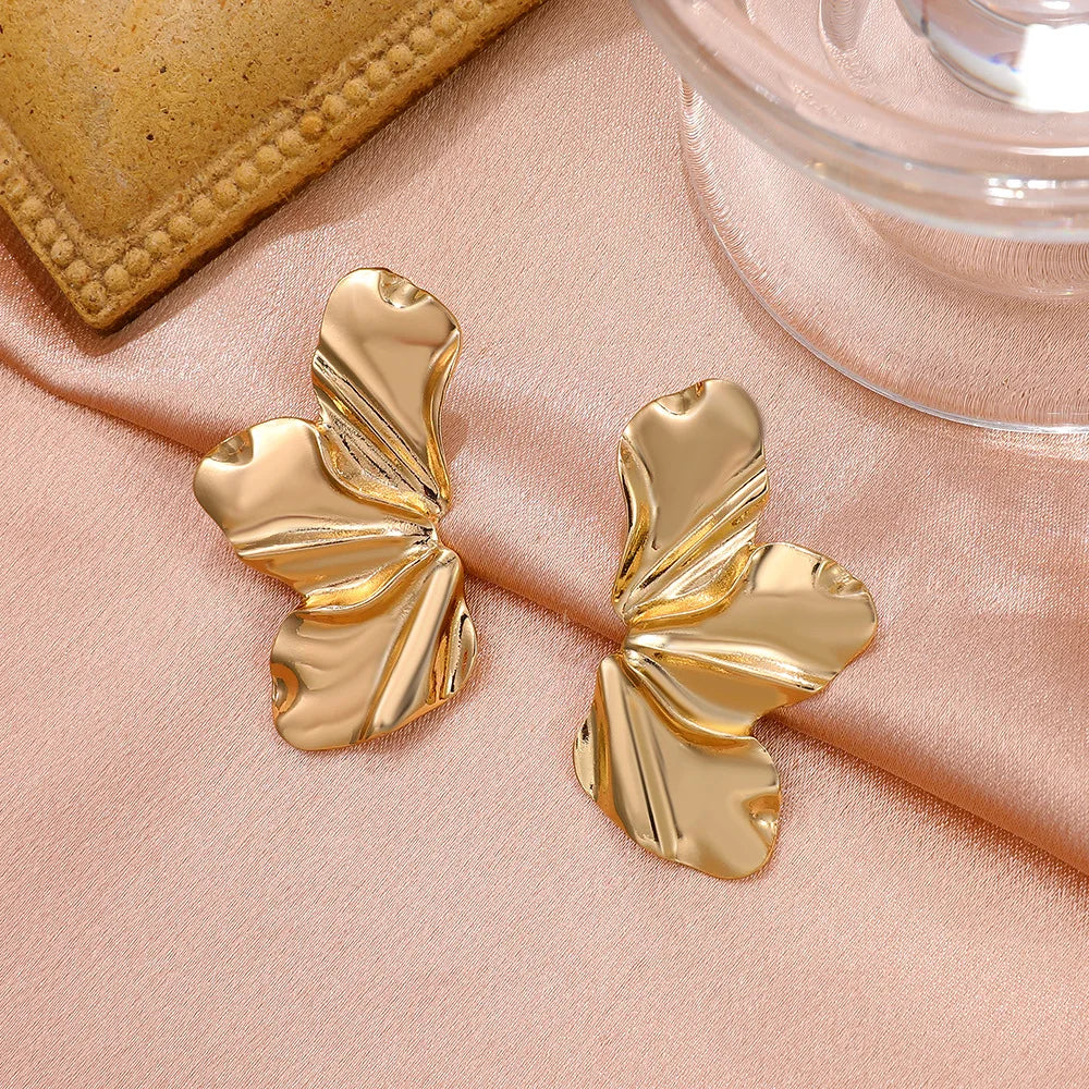 Women's metallic flower-shaped statement earrings