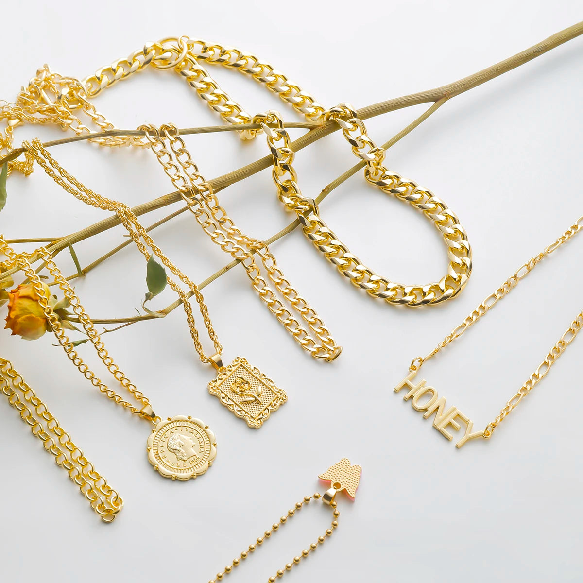 Gold layered chain necklace set with "Honey" pendant