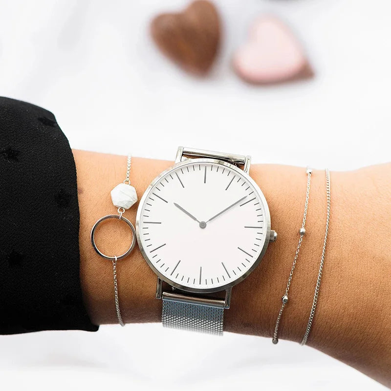 Minimalist mesh band quartz watch with ultra-slim dial for women
