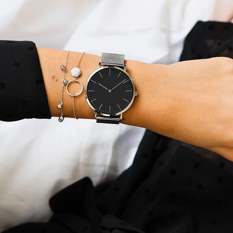 Minimalist mesh band quartz watch with ultra-slim dial for women