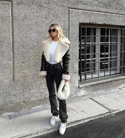 Women's black leather jacket with white fur