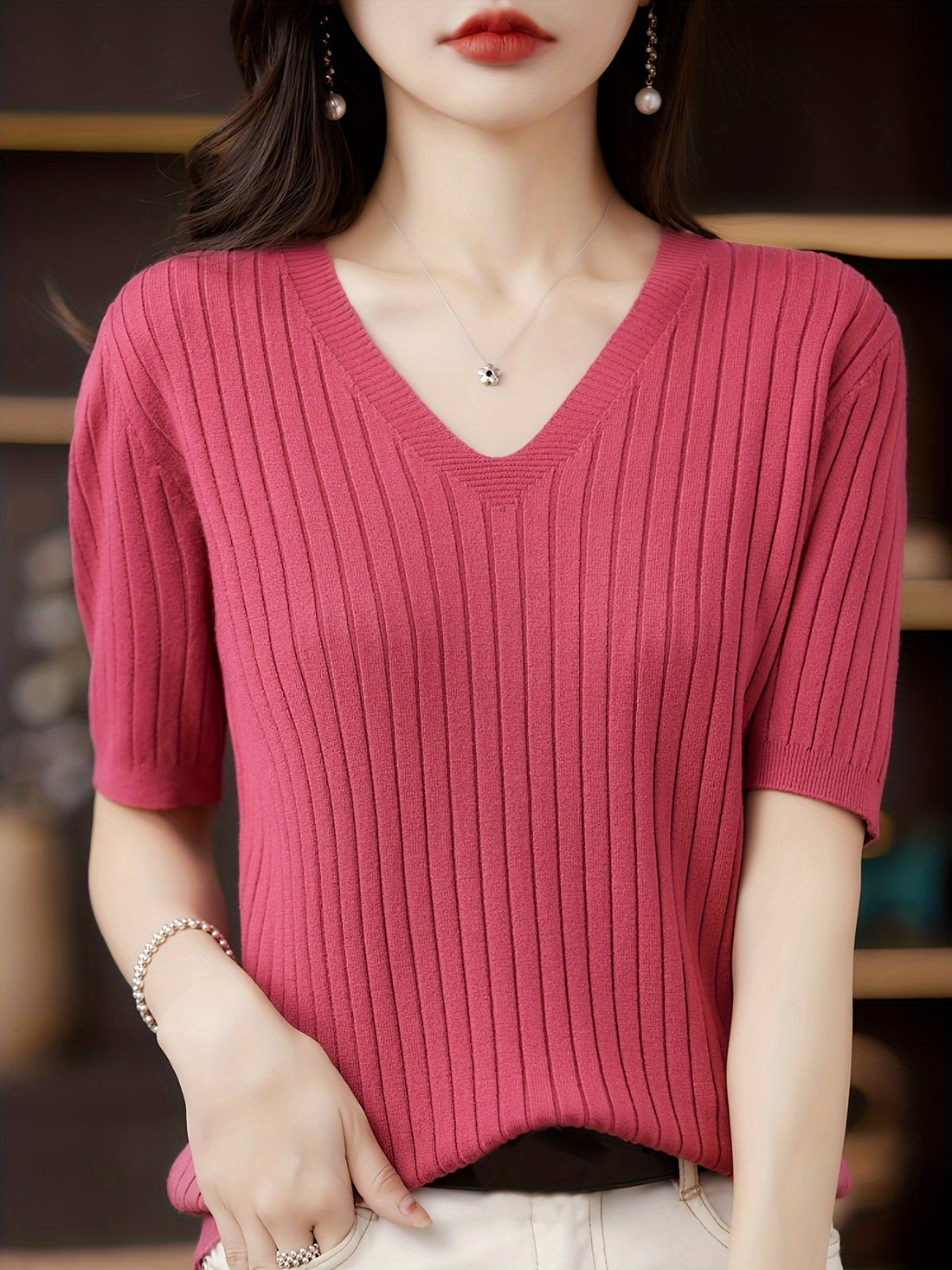 Stylish ribbed knit v-neck top with short sleeves and flattering fit for women