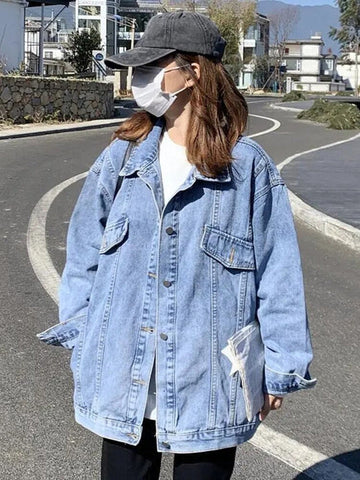 Women's long sleeve denim jacket with button closure