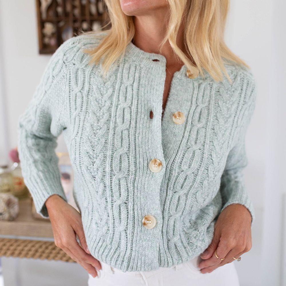 Fresh blue knitted sweater with crew neckline with button closure