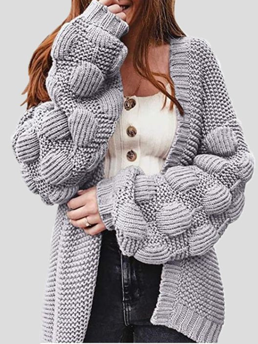 Women's chunky knit cardigan with pom pom sleeves and open front